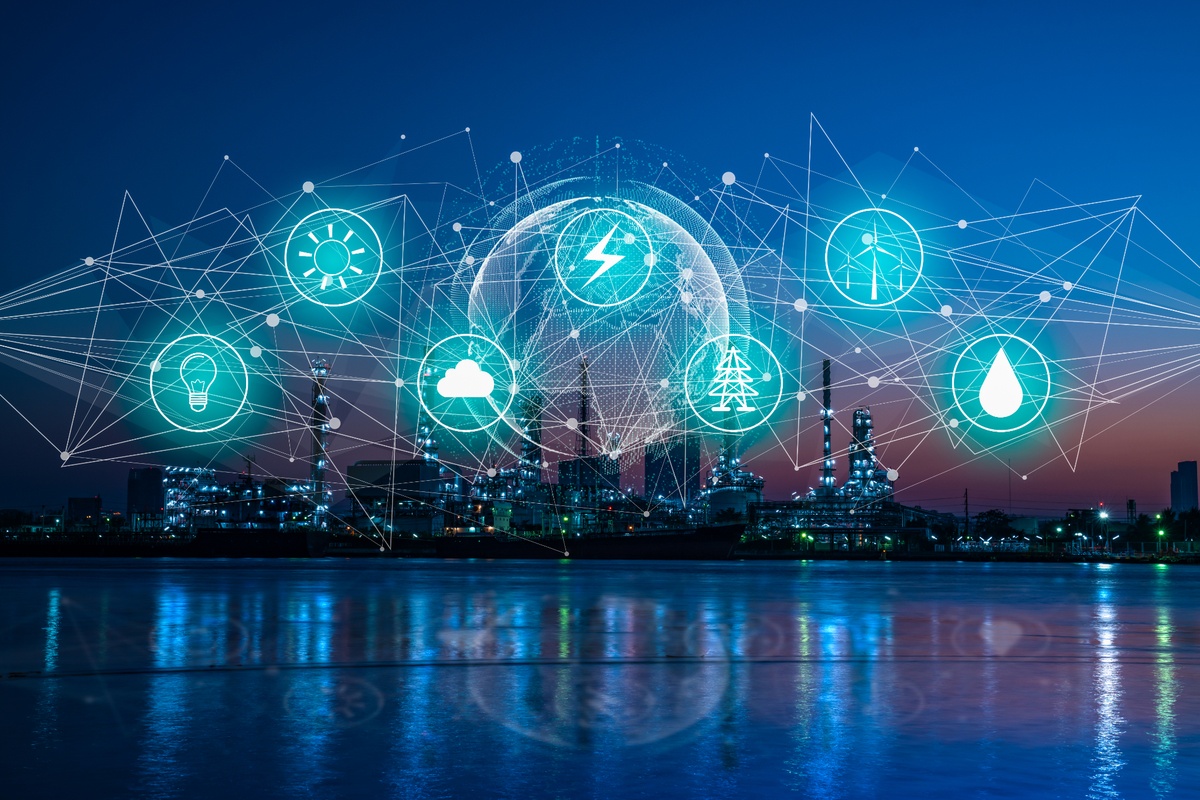 Visualisatie van de energietransitie waarbij industriële infrastructuur wordt gekoppeld aan digitale technologie, slimme netwerken en duurzame energiebronnen voor efficiënter energiebeheer. Actemium in Nederland.